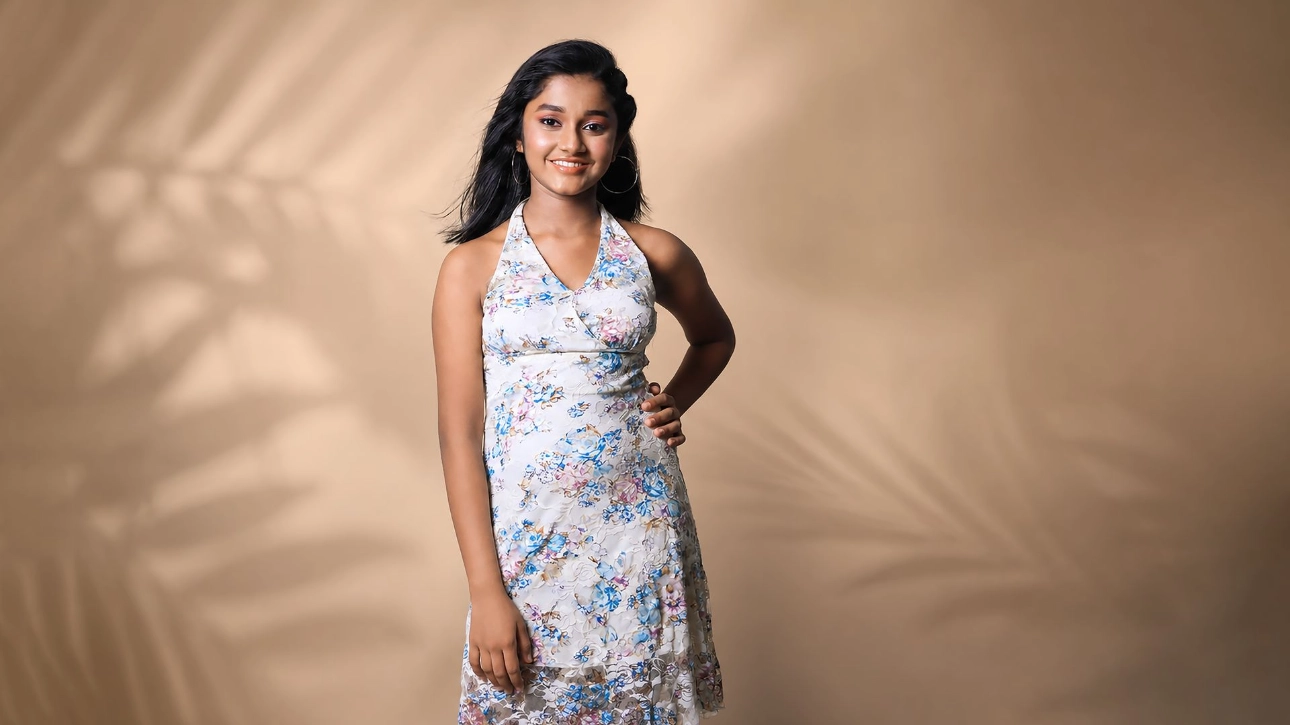 Ridhi Rajak posing in a floral dress during a professional fashion and commercial portfolio photoshoot, showcasing her confidence as a kid fashion model and child artist.